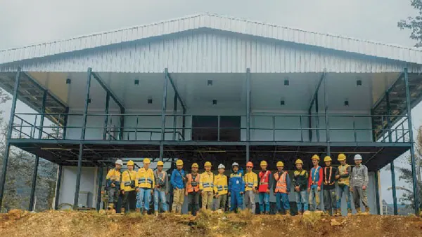 Engineer reviewing a construction camp building model for PT Rexline Engineering Indonesia (view 4)
