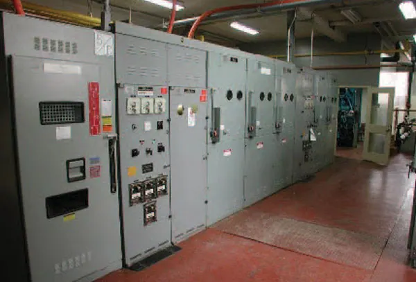 Technician wiring an electrical control panel for a PT Rexline Engineering Indonesia power system (view 5)
