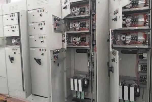 Technician wiring an electrical control panel for a PT Rexline Engineering Indonesia power system (view 6)