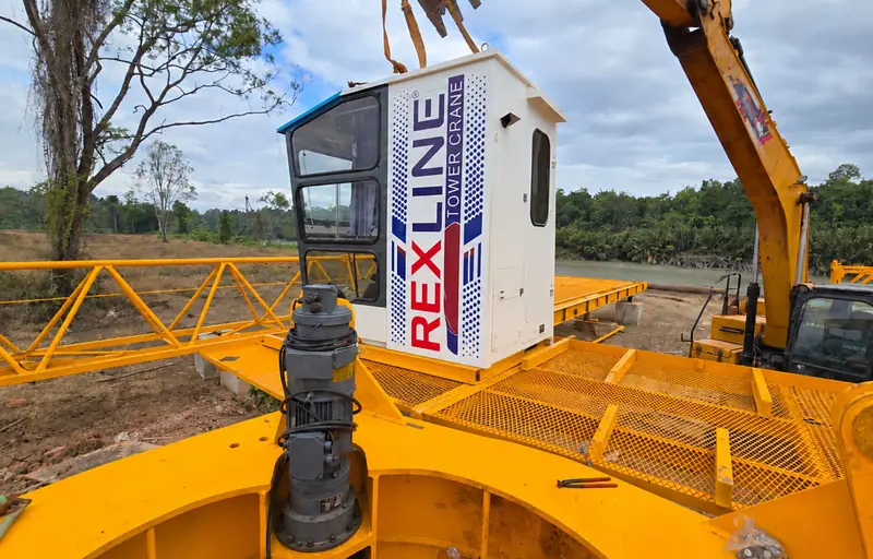 Marine Tower Crane Foundation & Erection — Fabricated jib assembly and Rexline operator-cabin installation